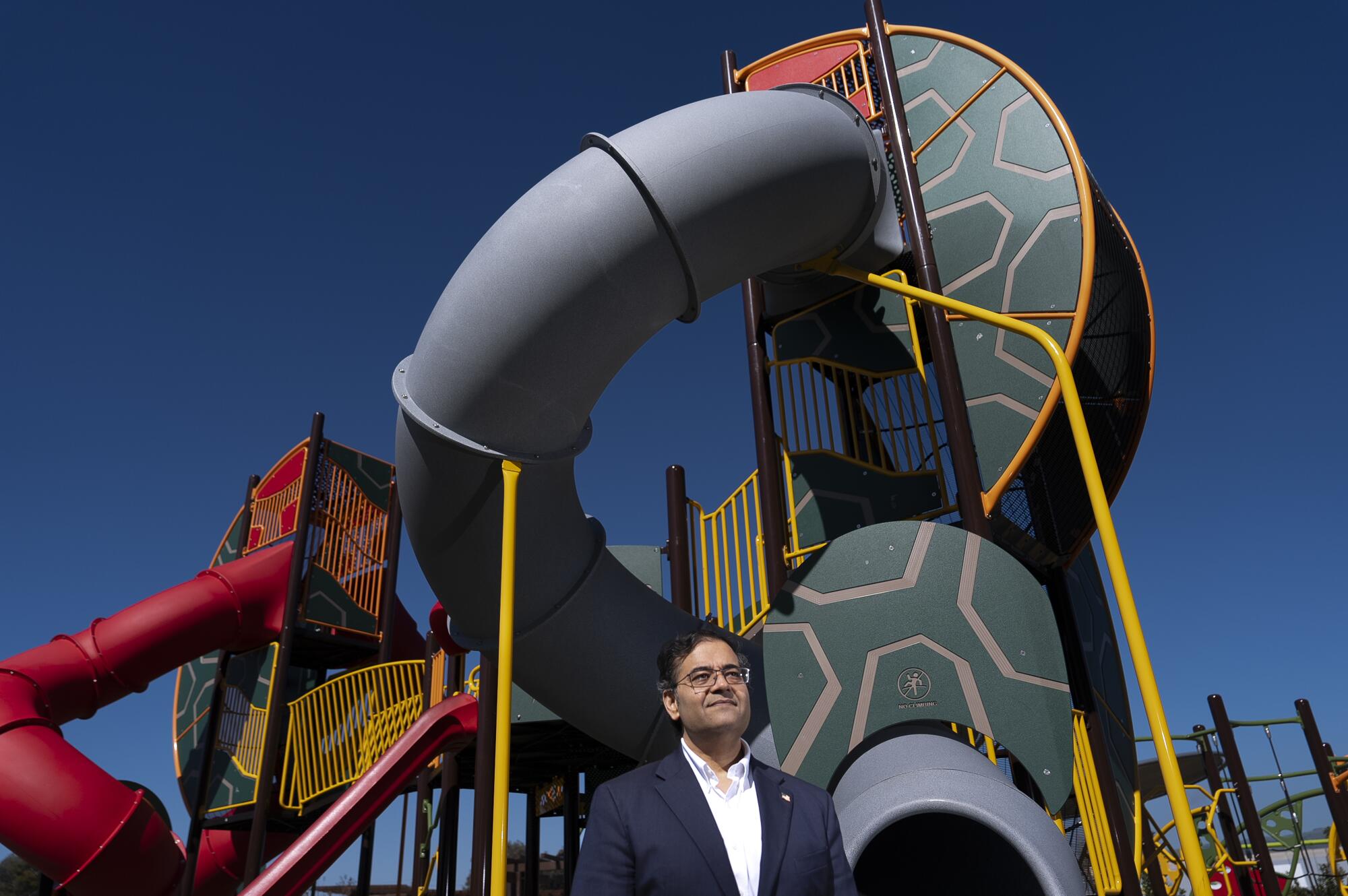 Fremont Mayor Raj Salwan stands in front of a colorful playground.