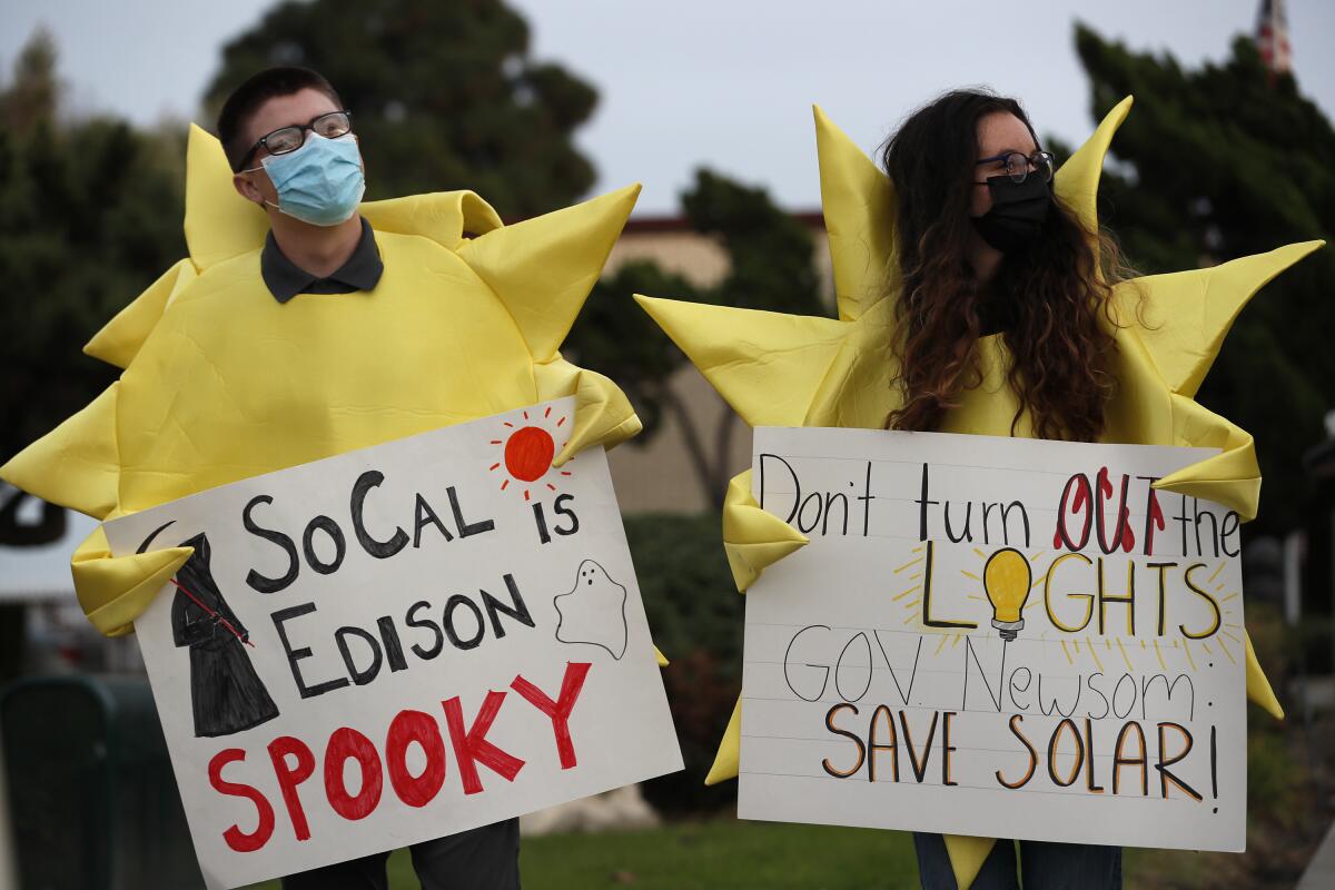 Protesters organized by the Solar Rights Alliance gather outside a Southern California Edison office in Long Beach in 2021.