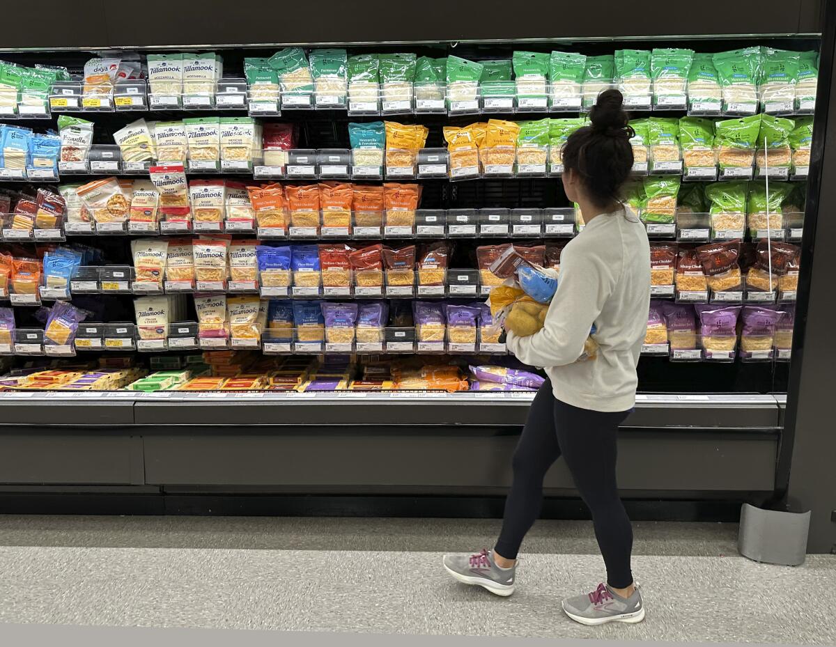 A shopper peruses cheese offerings at a Target store on Oct. 4, 2023, in Sheridan, Colo. 