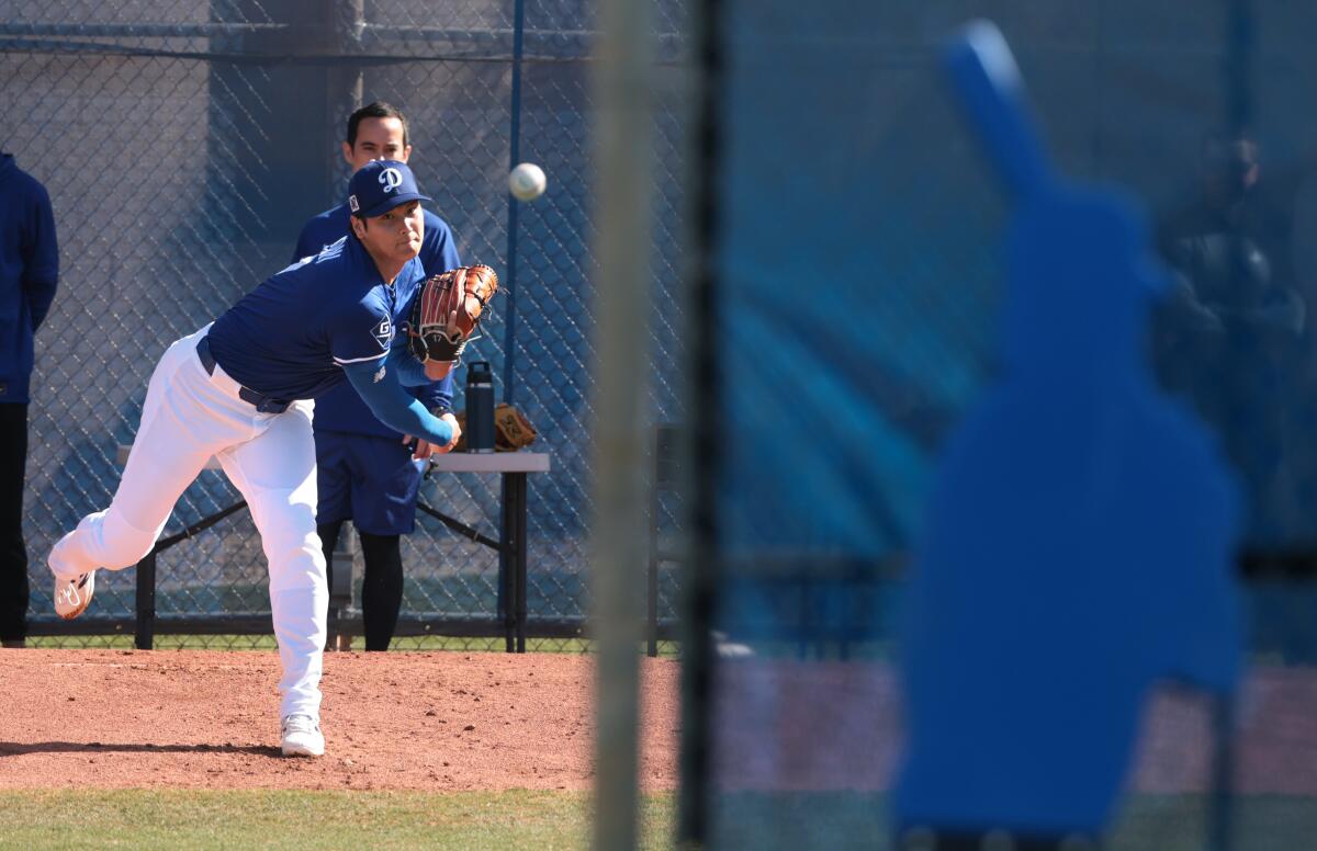 Shohei Ohtani throws during spring training at Camelback Ranch in Phoenix.