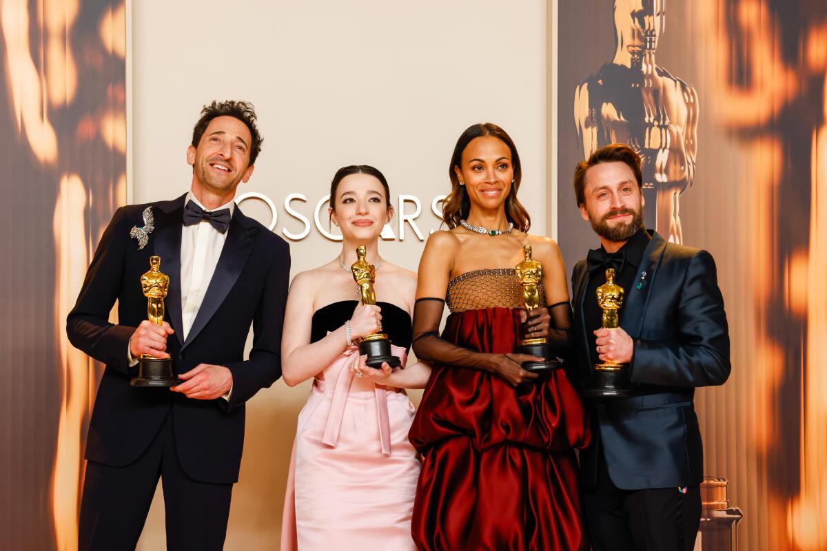 Four actors hoist Oscars.