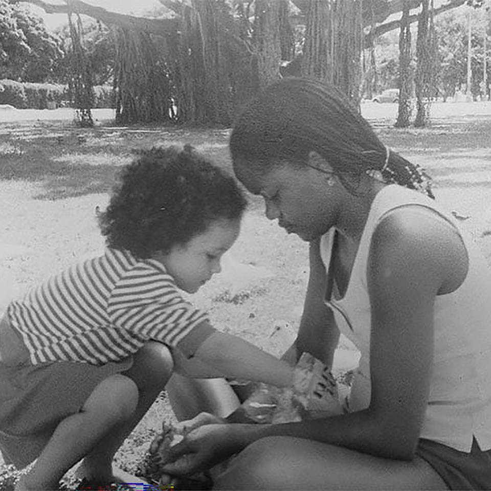 Black and white photo of Meghan Markle as a child with her mother.