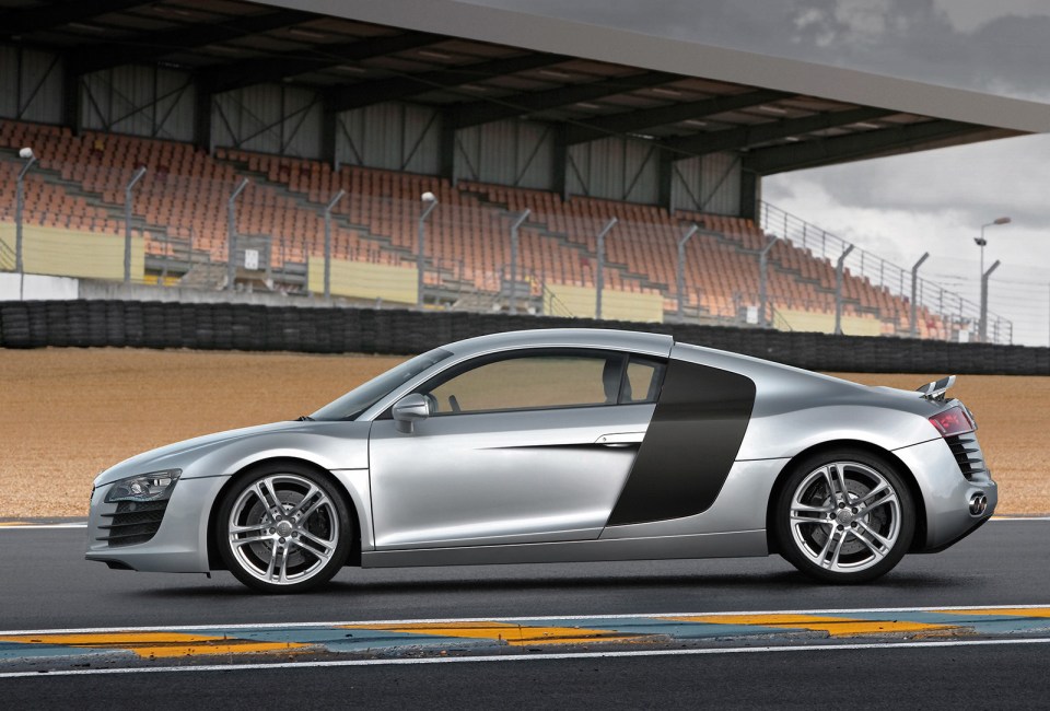 Silver Audi R8 on a racetrack.