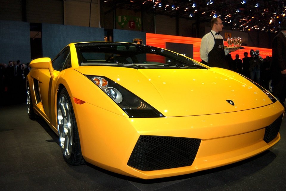 Yellow Lamborghini Gallardo at a car show.