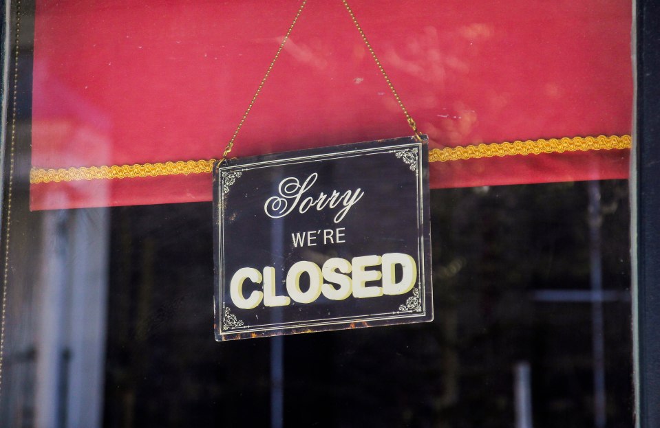 Closed sign in a window.