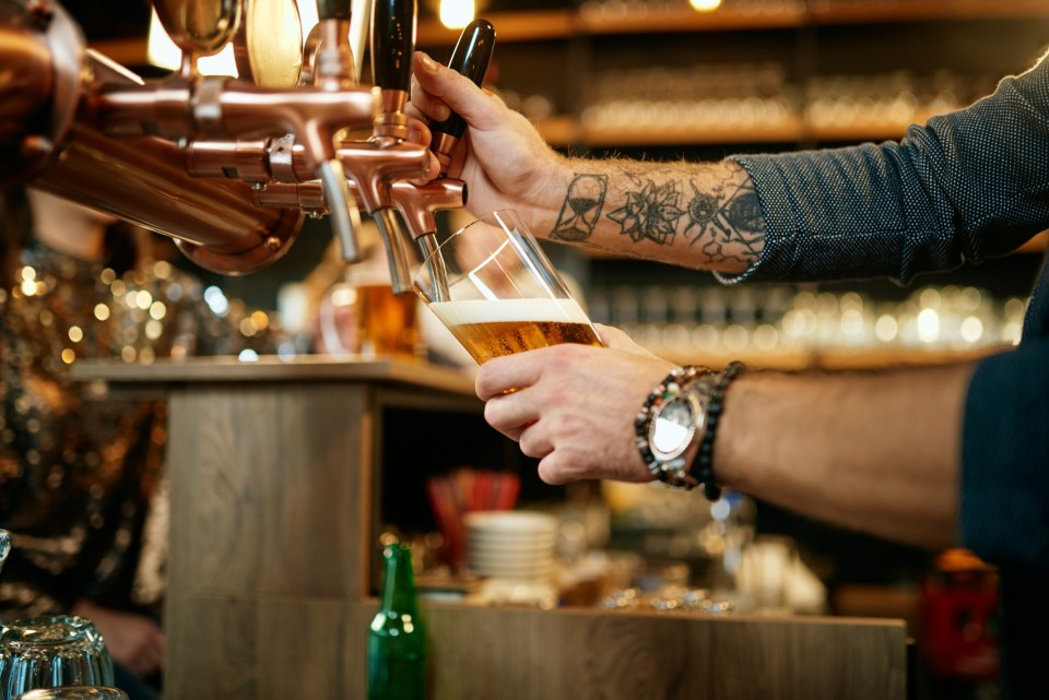 Bartender pouring beer.