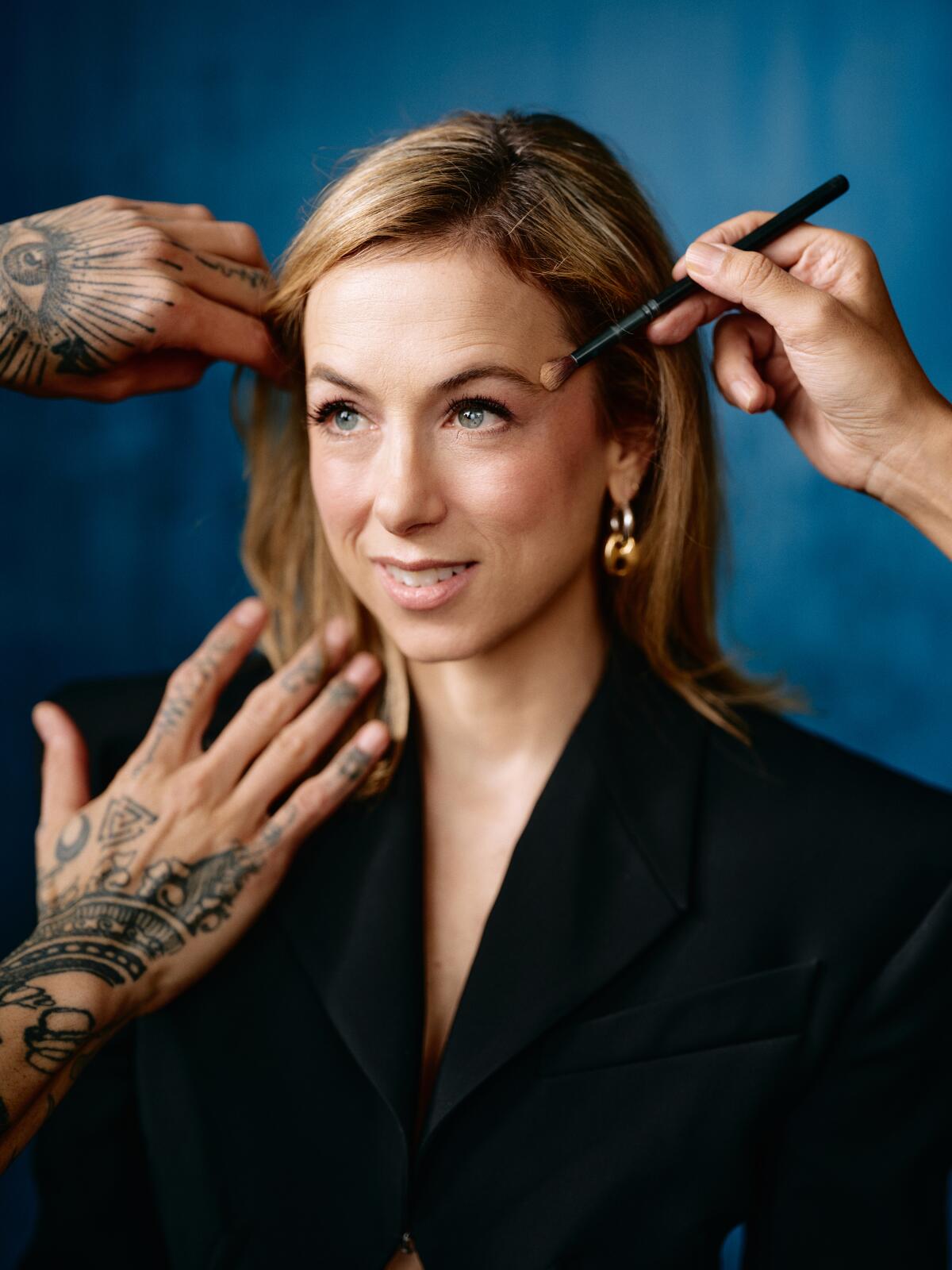 Portrait of comedian Iliza Shlesinger getting hair and makeup done