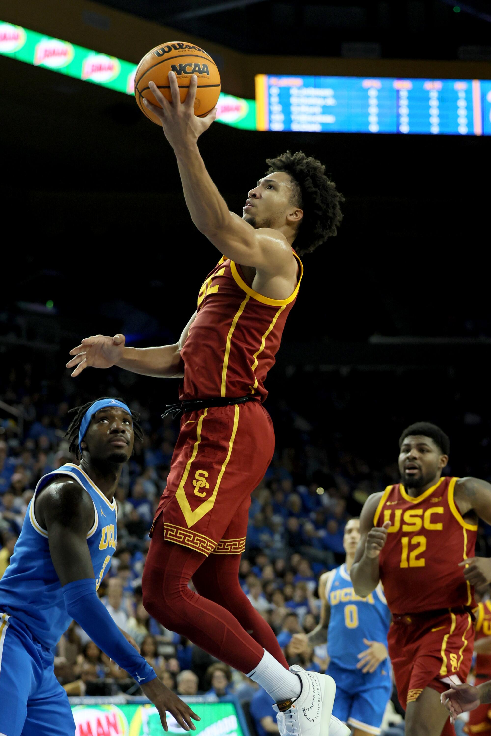 USC guard Wesley Yates makes a left-handed layup during a game against UCLA on Saturday.