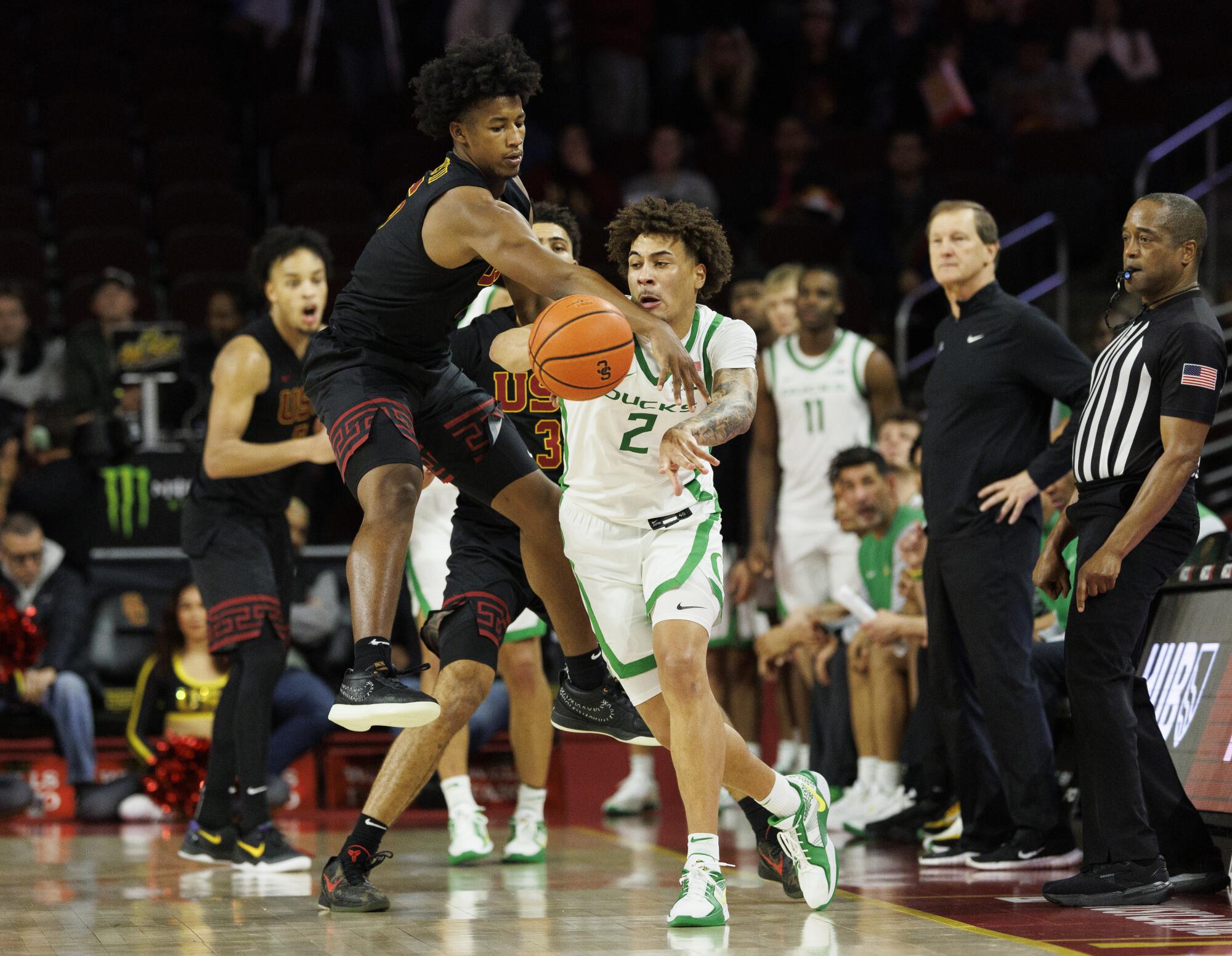 USC guard Wesley Yates reaches in for a steal against Oregon guard Jadrian Tracey during a game earlier this season.