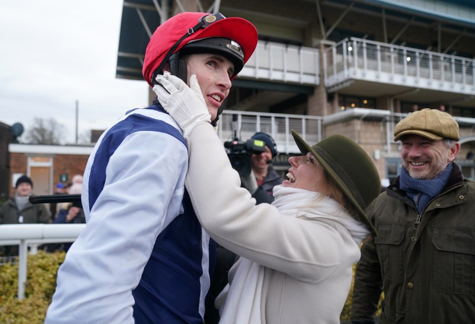 Geri and Christian Horner celebrating with their winning jockey at a racetrack.