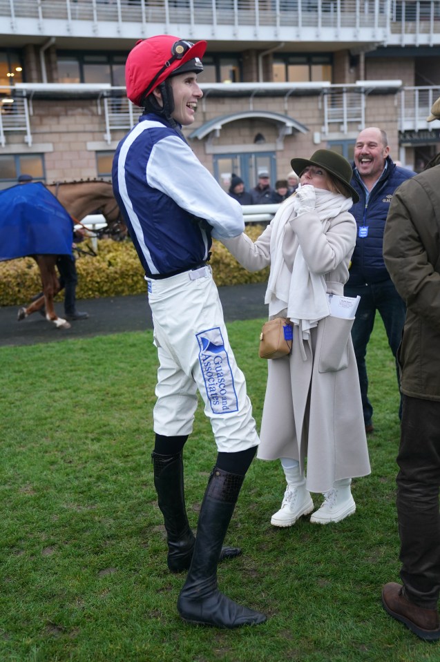 Geri Horner with jockey Jack Andrews at a racecourse.