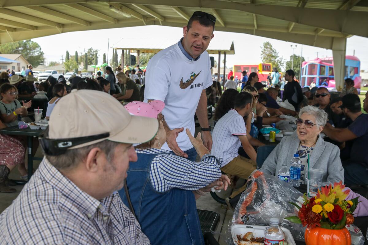 David Valadao speaking with people at the Buttonwillow Fall Farm Festival