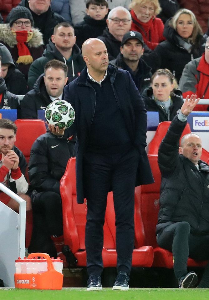 Liverpool manager Arne Slot holding a Champions League ball.