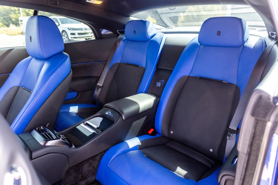 Interior of a blue and black Rolls-Royce Wraith Black Badge.