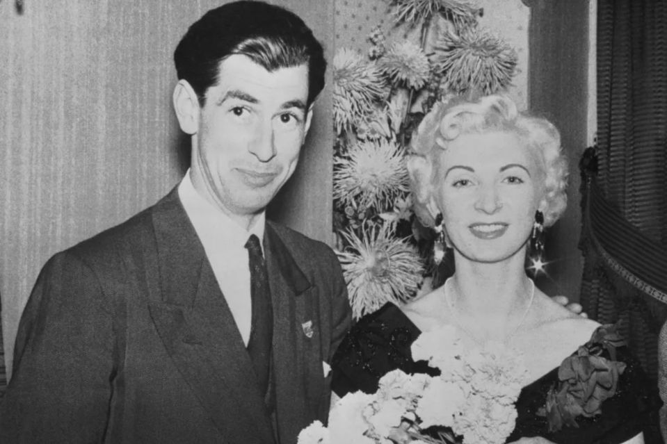 Black and white photo of David Blakeley, a racecar driver, and a woman.