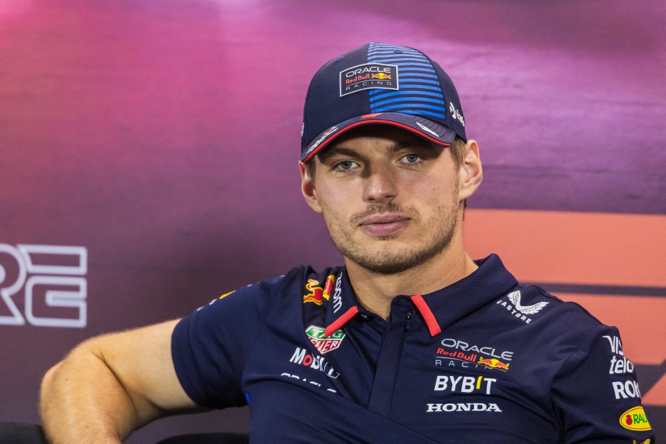 a man wearing a hat that says oracle red bull racing