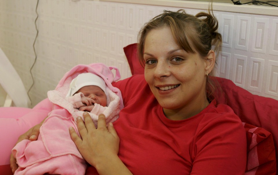 A woman holding her newborn baby in the Big Brother house.