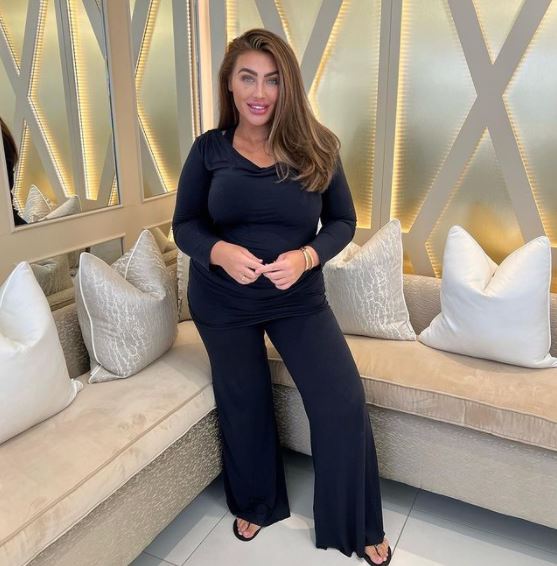 Lauren Goodger in a black lounge set.