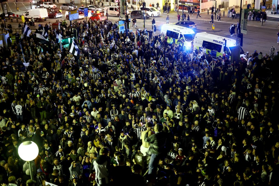 Newcastle United fans celebrating a Carabao Cup victory.