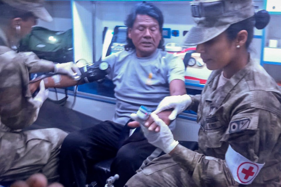 Peruvian Navy medics attending to a rescued fisherman.