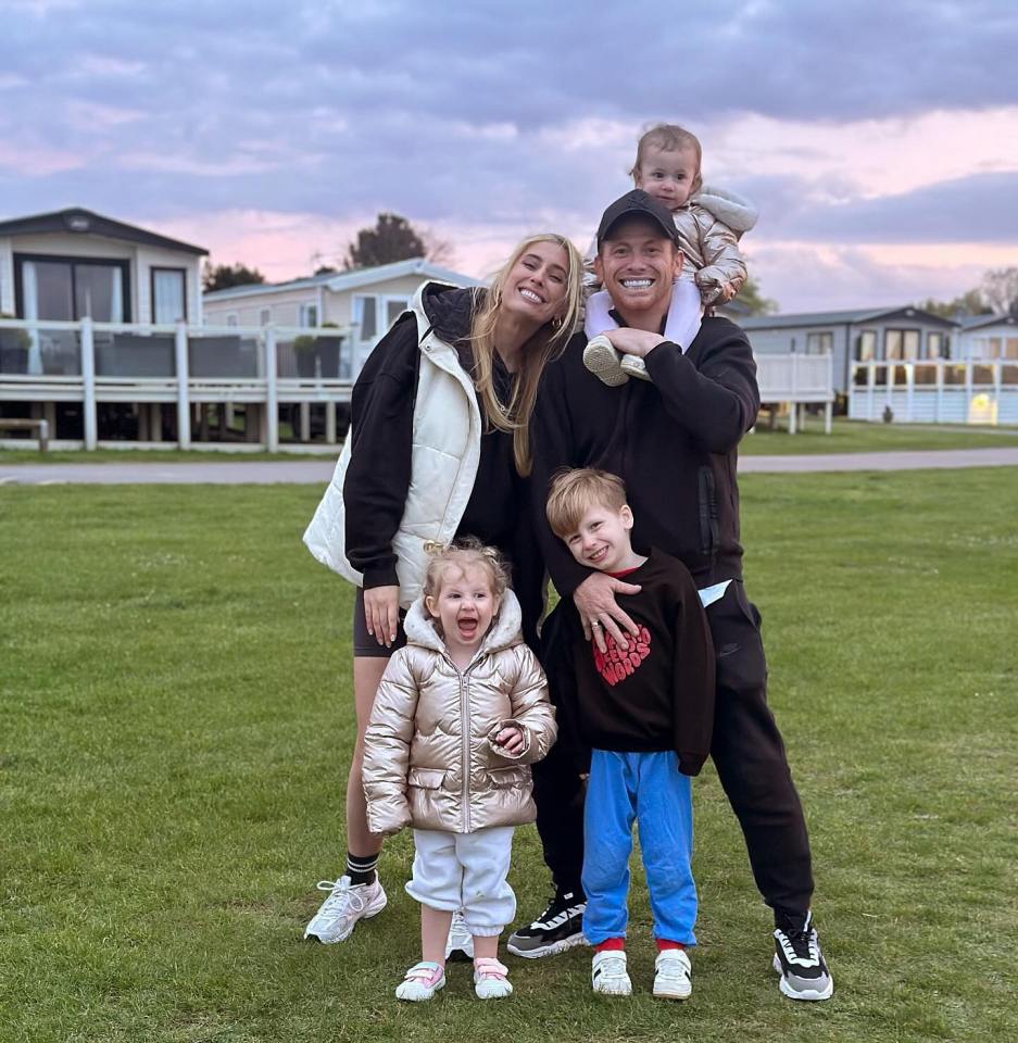 Family portrait in front of holiday park homes.