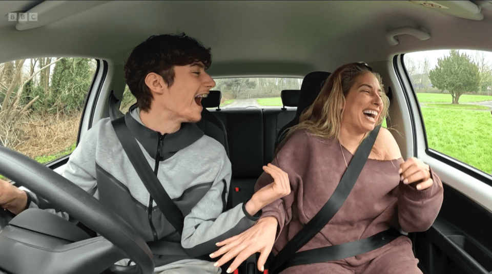 Stacey Solomon and Joe Swash laughing in a car.