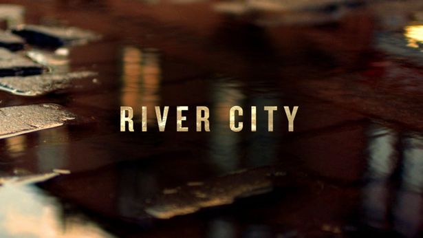 Logo for River City showing a puddle on a street.