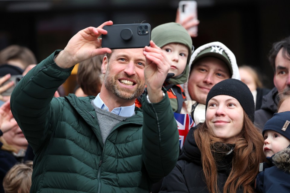 Prince William taking selfies with well-wishers in Tallinn, Estonia.