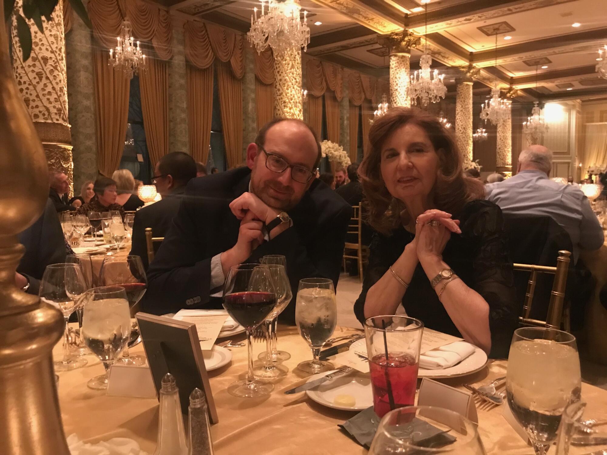 The author, Todd Martens, left, and his mother, Donna, at a recent wedding in Chicago. Donna died unexpectedly this month.