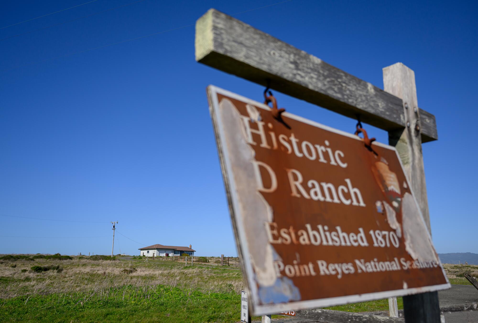 A sign for Historic D Ranch blows in the wind at Point Reyes National Seashore.