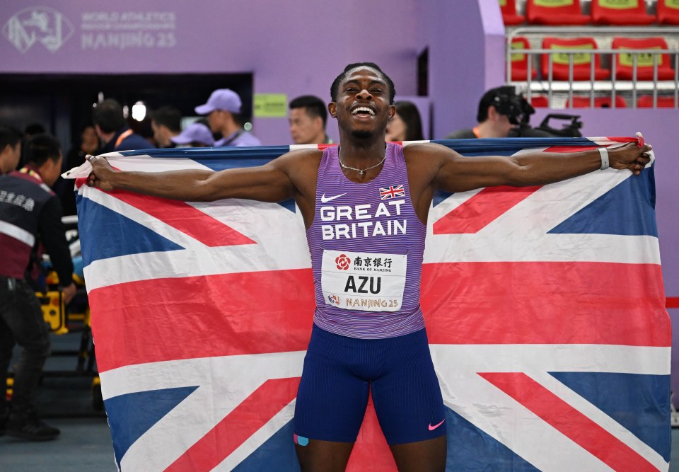 Jeremiah Azu of Great Britain celebrates with a Union Jack flag after winning the men's 60m final.