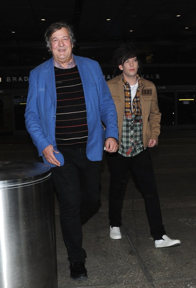 Stephen Fry and his husband, Elliot Spencer, arriving at LAX airport.