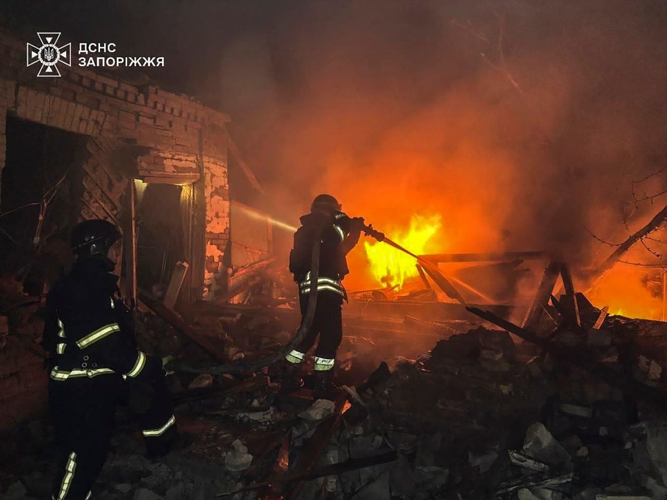 Ukrainian rescuers battling a fire at a drone attack site in Zaporizhzhia.