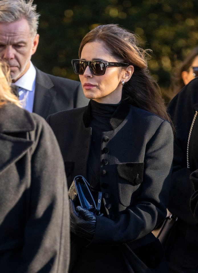 Cheryl leaving a funeral.