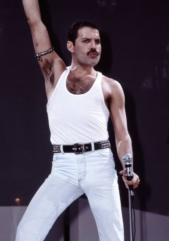 Freddie Mercury of Queen performing on stage.