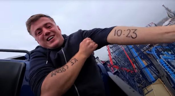 Harry Moulding in a dark hoodie sat on a rollercoaster with writing on his arms in footage shared on Britain's Got Talent 2025.