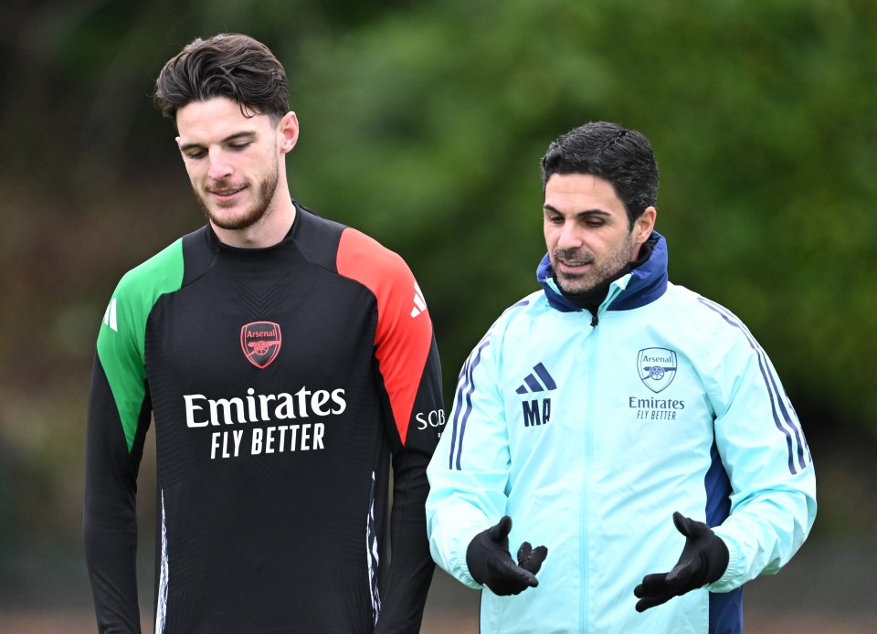 Mikel Arteta and Declan Rice at an Arsenal training session.