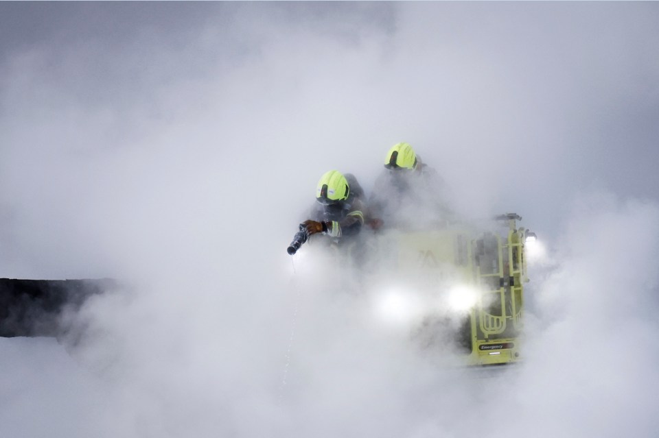 Firefighters extinguishing a fire at Heathrow Airport.