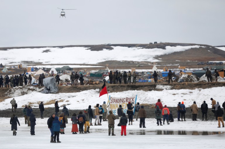 people stand in lines in the snow