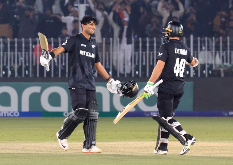 Cricket - ICC Men's Champions Trophy - Group A - New Zealand v Bangladesh - Rawalpindi Cricket Stadium, Rawalpindi, Pakistan - February 24, 2025 New Zealand's Rachin Ravindra celebrates reaching his century with Tom Latham REUTERS/Akhtar Soomro