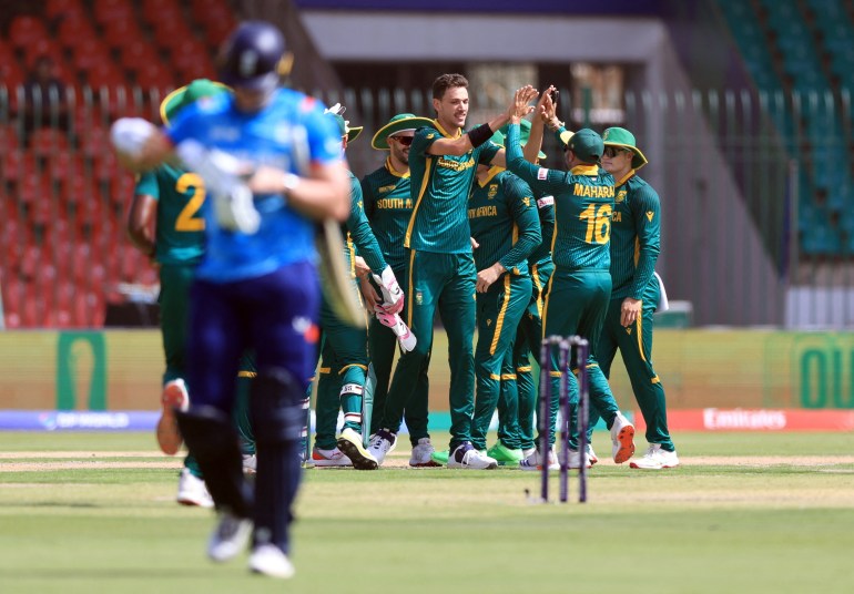 Cricket - ICC Men's Champions Trophy - Group B - England v South Africa - National Stadium, Karachi, Pakistan - March 1, 2025 South Africa's Marco Jansen celebrates with teammates after taking the wicket of England's Jamie Smith, caught out by Aiden Markram REUTERS/Akhtar Soomro