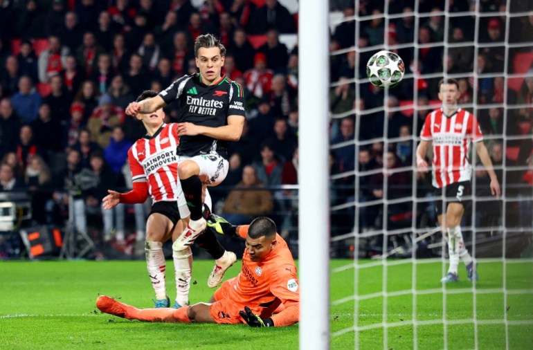 Soccer Football - Champions League - Round of 16 - First Leg - PSV Eindhoven v Arsenal - Philips Stadion, Eindhoven, Netherlands - March 4, 2025 Arsenal's Leandro Trossard scores their fifth goal Action Images via Reuters/Matthew Childs TPX IMAGES OF THE DAY