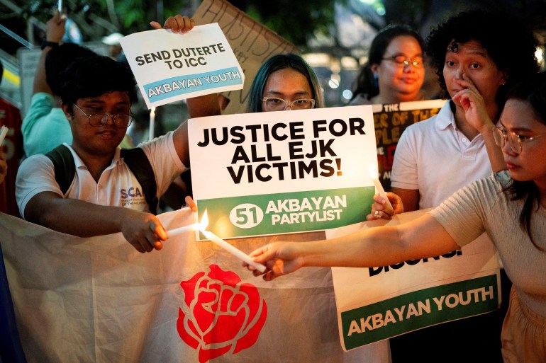 Students light candles during a protest following the arrest of former Philippine President Rodrigo Duterte, in Quezon City, Philippines, March 11, 2025. REUTERS/Lisa Marie David