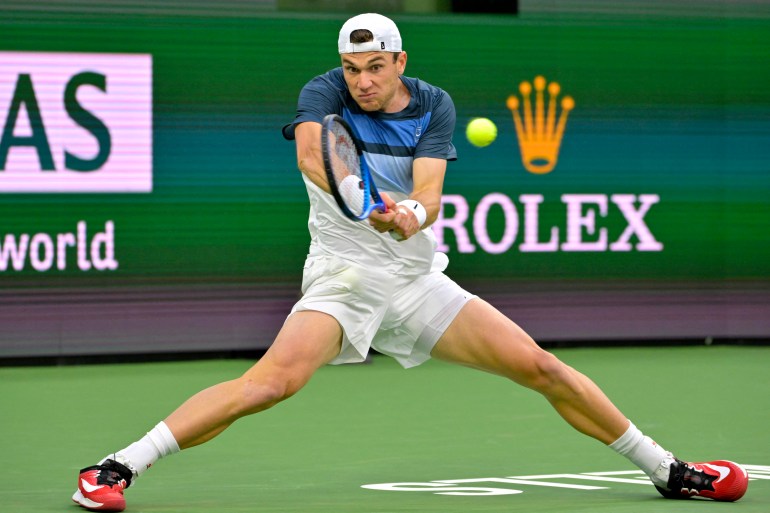 Mar 13, 2025; Indian Wells, CA, USA; Jack Draper (GBR) his a shot as he defeated Ben Shelton during his quarterfinal match against (not pictured) in the BNP Paribas Open at the Indian Well Tennis Garden. Mandatory Credit: Jayne Kamin-Oncea-Imagn Images