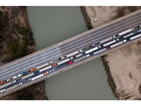 Trucks in line to enter the United States at the World Trade Bridge port of entry on the US-Mexico border in Laredo, Texas, in February. Photographer: Cheney Orr/Bloomberg