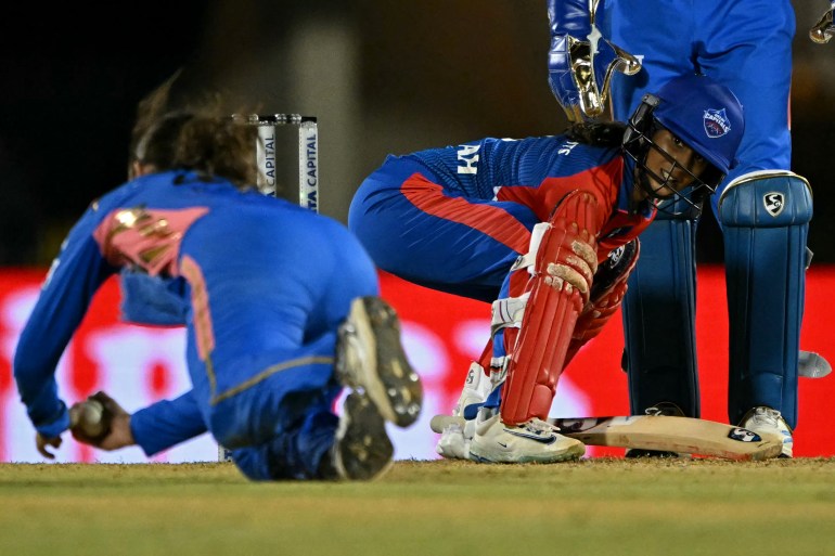 Mumbai Indians' Amelia Kerr takes the catch to dismiss Delhi Capitals' Jemimah Rodrigues (R) during the Women's Premier League (WPL) Twenty20 final cricket match between Mumbai Indians and Delhi Capitals at Brabourne Stadium in Mumbai on March 15, 2025. (Photo by INDRANIL MUKHERJEE / AFP) / -- IMAGE RESTRICTED TO EDITORIAL USE - STRICTLY NO COMMERCIAL USE --