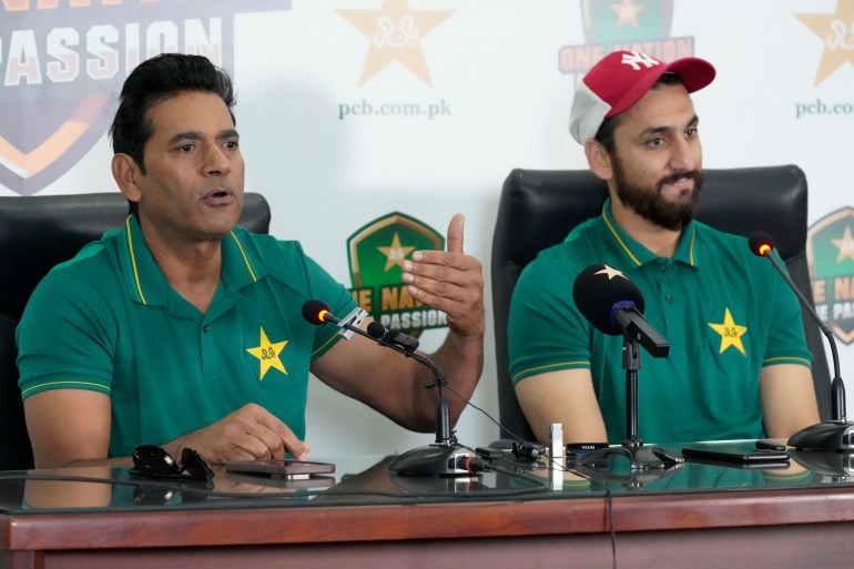 Pakistan interim head coach Aaqib Javed, left, speaks as Salman Ali Agha watches during a press conference to announce squad for upcoming New Zealand tour, in Lahore, Pakistan, Tuesday, March 4, 2025. (AP Photo/K.M Chaudary)