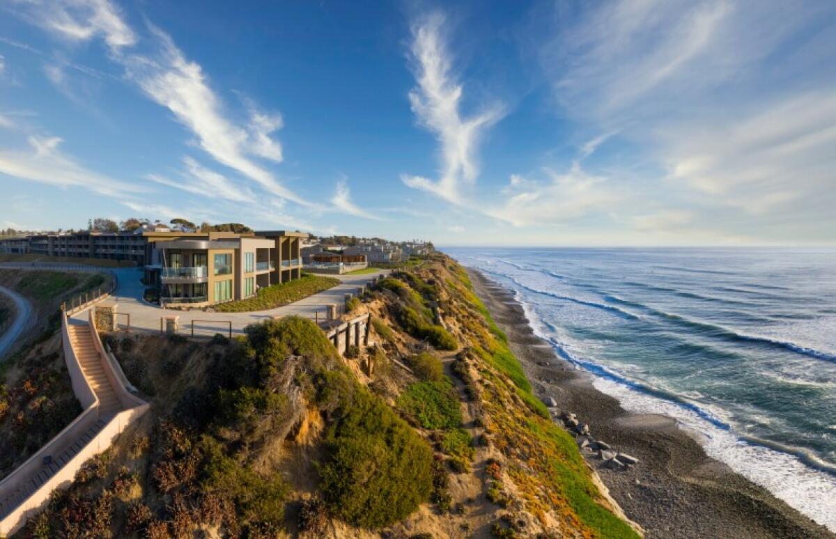 A hotel on a cliff top overlooking the Pacific Ocean