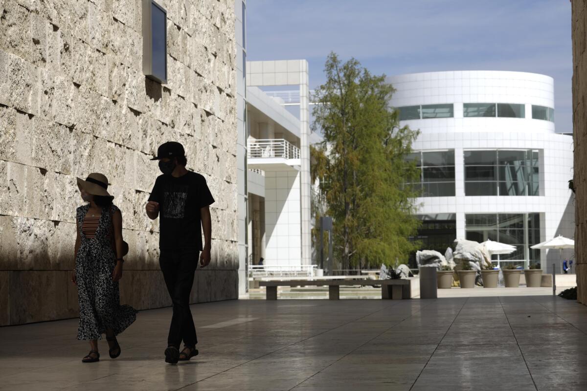 Visitors walk between buildings at The Getty Center