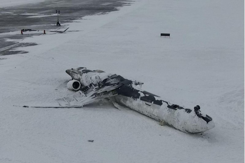 The remains of the Endeavor Air Bombardier CL-600-2D24 rests after one of its main landing gear failed and caused the aircraft to flip while landing at a Toronto airport on February 17. Photo by the Transportation Safety Board of Canada